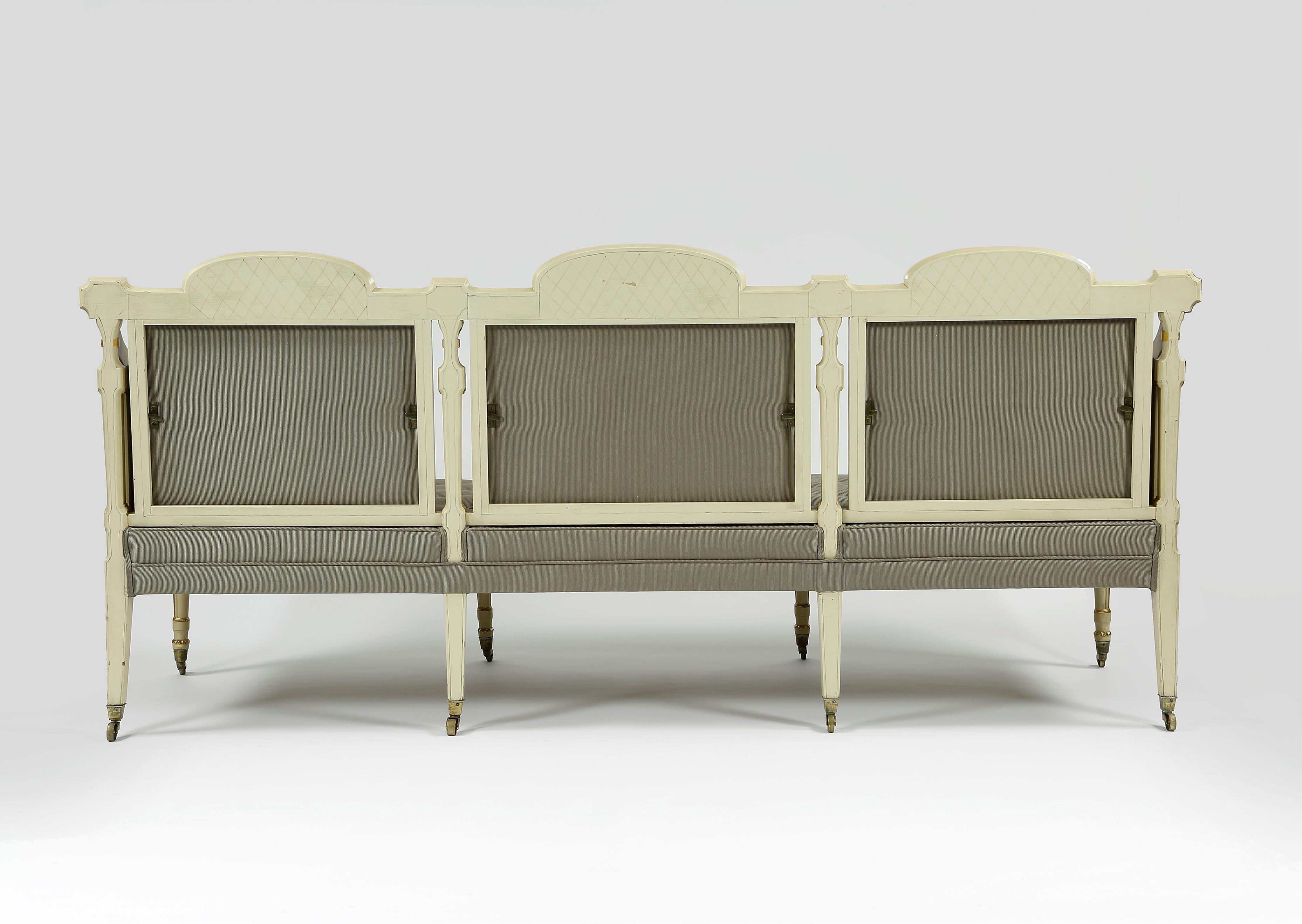 A pair of George III cream painted and parcel gilt settees, in the manner of George Brookshaw (1751-1823)